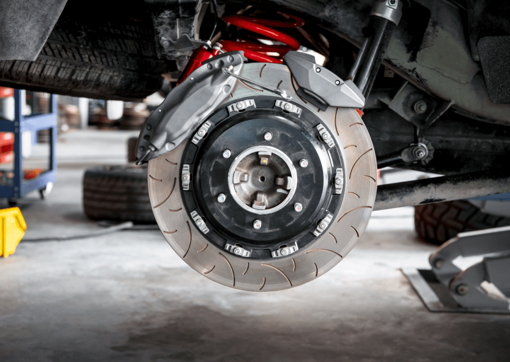 Close-up of a high-performance brake system with new brake pads, highlighting signs to replace brake pads for safety.