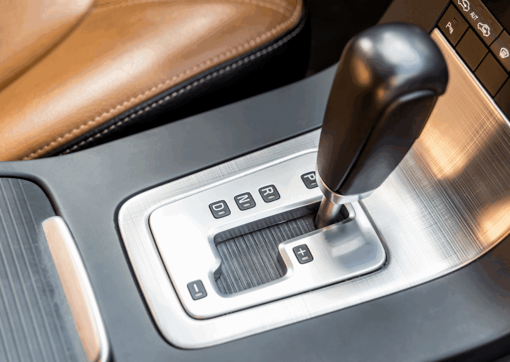 Close-up of car gear shift lever used in vehicles requiring automatic transmission repairs and maintenance.