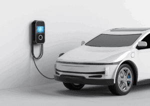 Electric car charging at wall station as part of an electric vehicle maintenance schedule routine.