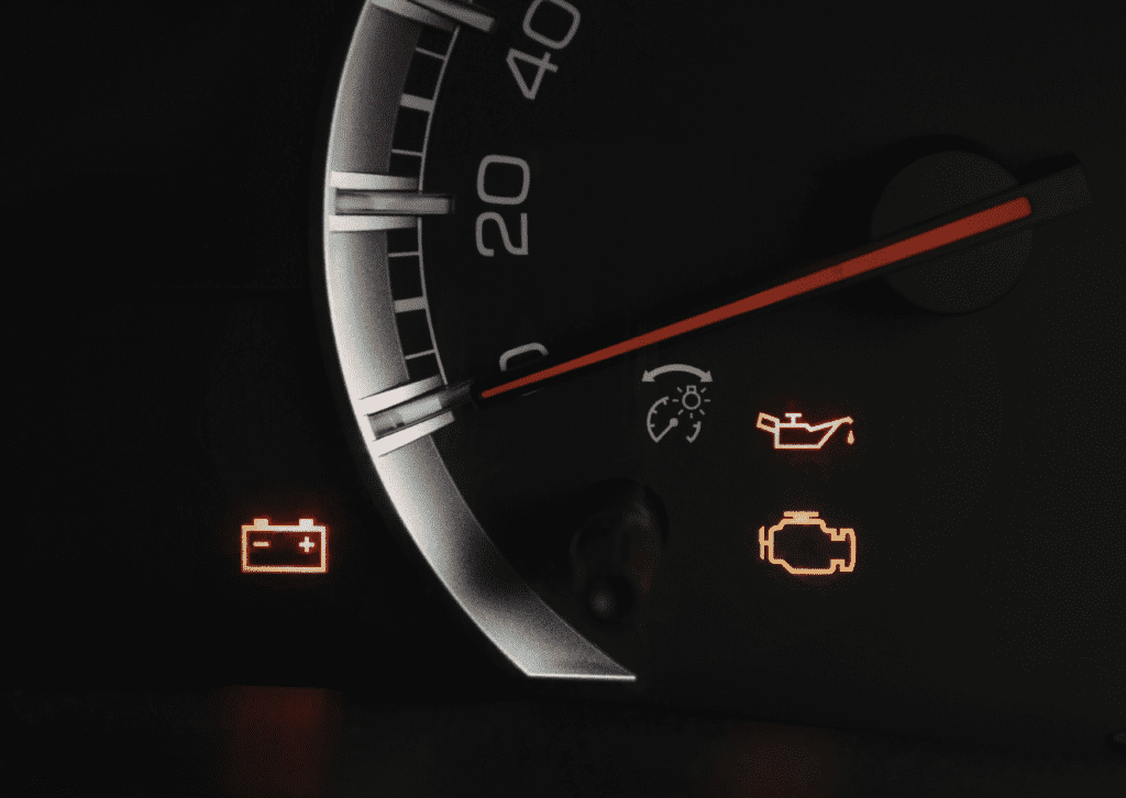 Dashboard warning lights show battery, oil, and flashing check engine light vs solid alerts 