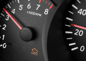 Dashboard tachometer with warning icon for flashing check engine light vs solid repair issue