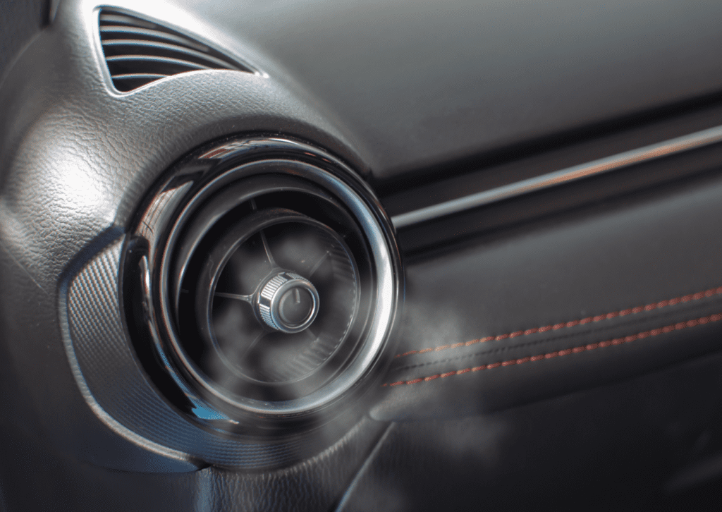 Close-up of cool air flowing from vehicle vent during car ac and climate control repair work