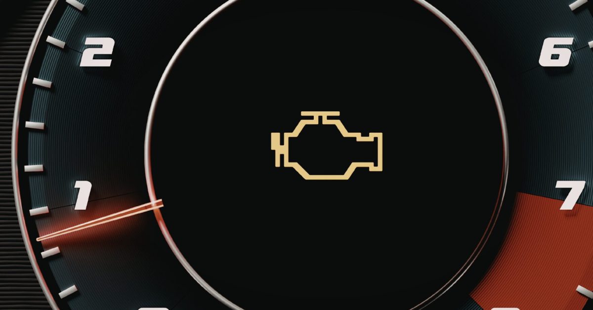 Close-up dashboard tachometer with check engine light flashing, needle near 1, red zone ahead glow.