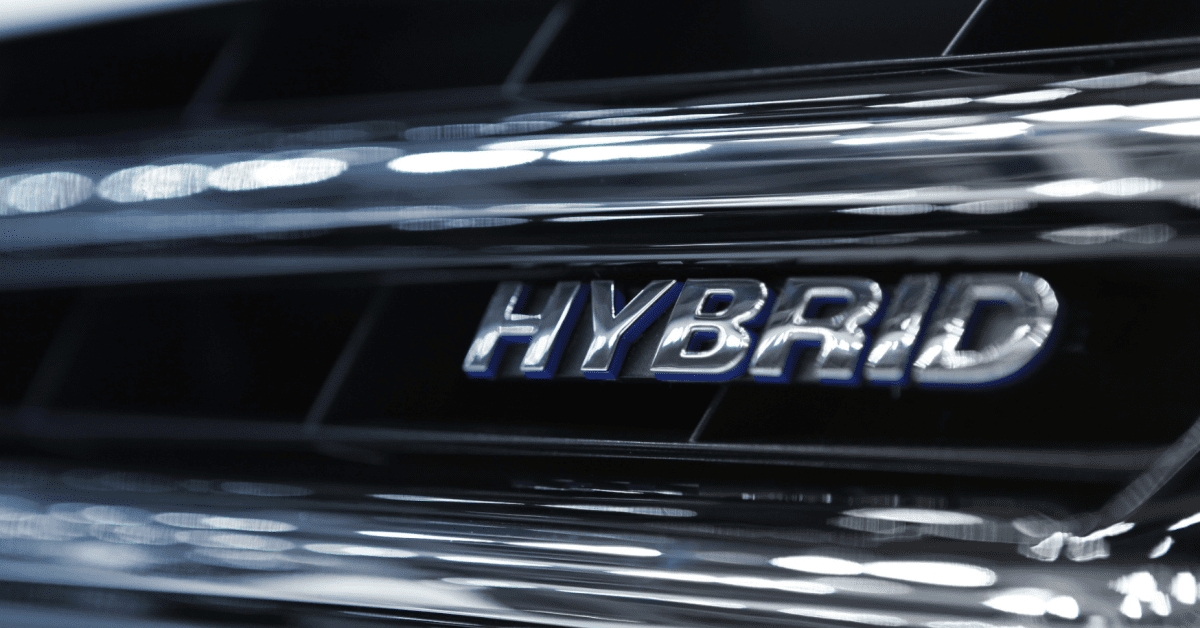 Close-up of hybrid badge on grille for hybrid and luxury vehicle service and diagnostics care 