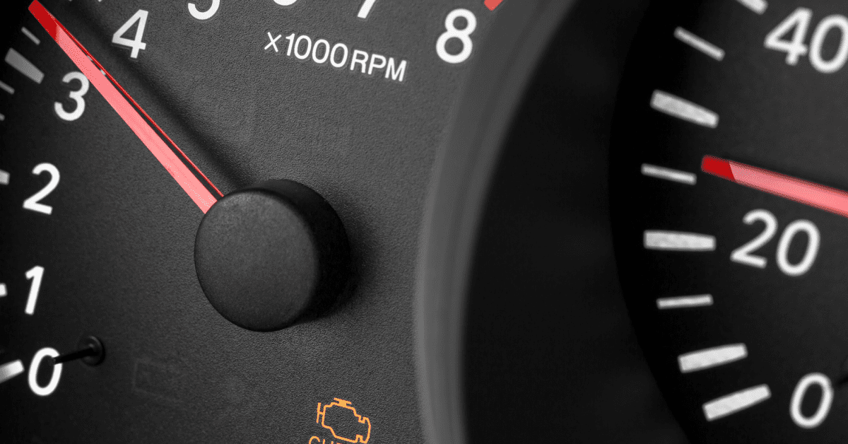 Dashboard tachometer with warning icon for flashing check engine light vs solid repair issue